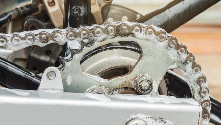 Washing and cleaning motorcycle chain.