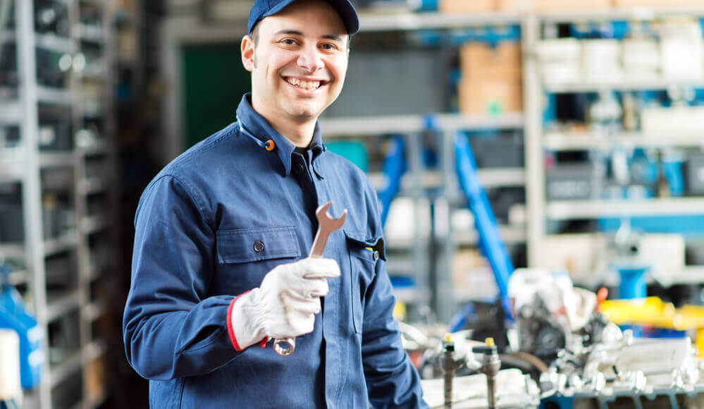 Mechanic repairing diesel engine.