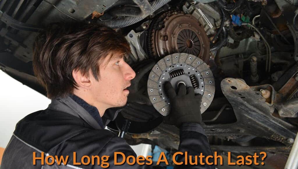 A mechanic is inspecting and replacing the clutch disc.